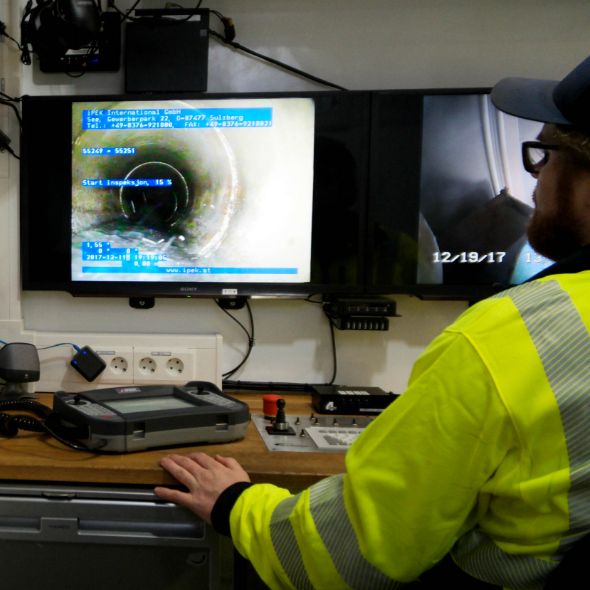 Staff locking at a screen.