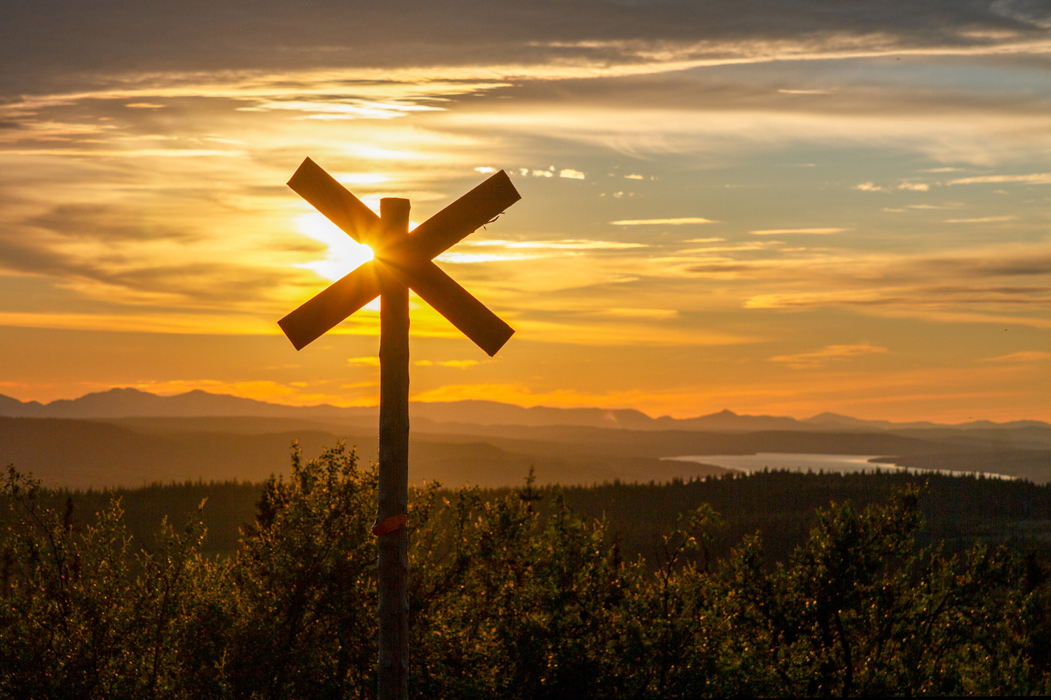 snowmobile trail pole in sunset